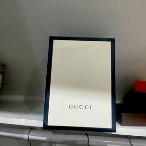 Gucci bag box with ribbon .